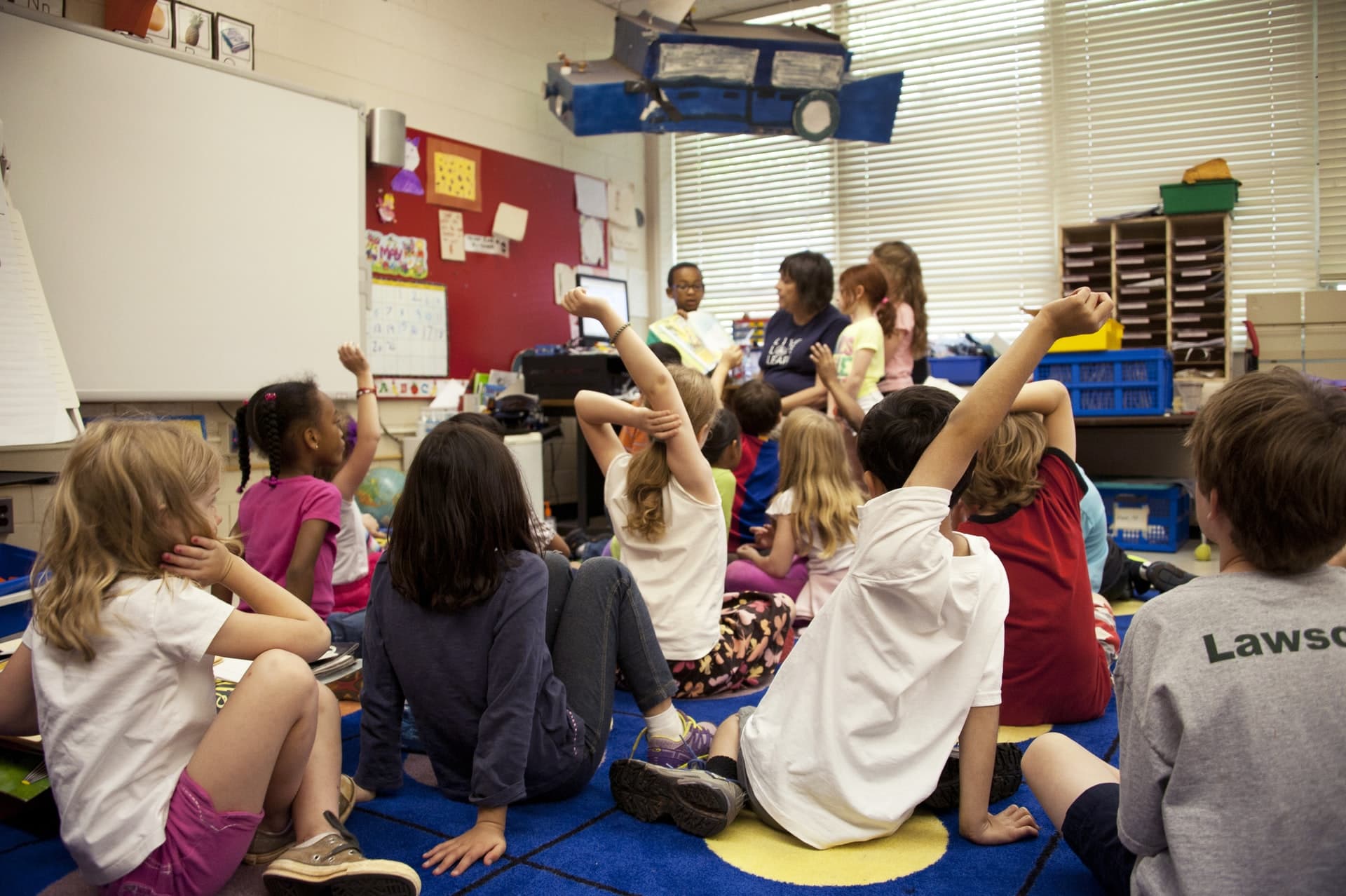 Raise hands in a classroom